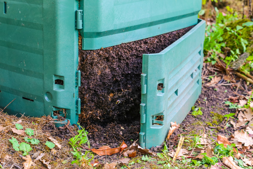 Finished compost spilling out of a compost bin | The Coeur d Alene Coop