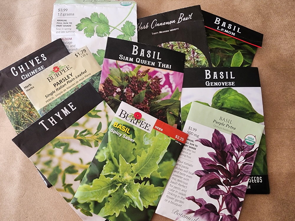 an assortment of herb seed packets.